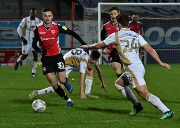 Aaron Collins seeks his fifth goal since joining Morecambe last month when they go to Swindon Town on Saturday
