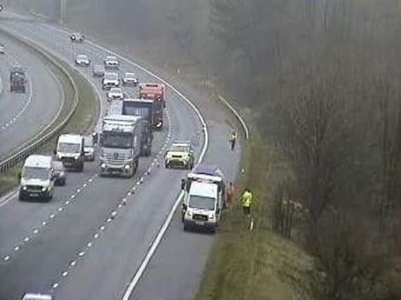 Police have closed a stretch of M6 between Preston and Lancaster after a lorry pulled onto the hard shoulder with a damaged tyre.