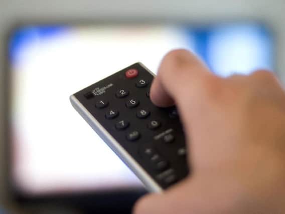 Britons would rather watch TV at home than go out, survey suggests