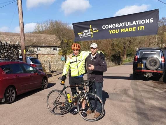 Ian is greeted in Devon after his epic cycle ride by charity founder Mac Mackenney
