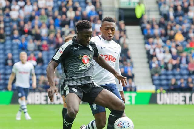 Preston right-back Darnell Fisher battles with Reading's Andy Yiadom at Deepdale in September - Reading are PNE's next opponents on Saturday