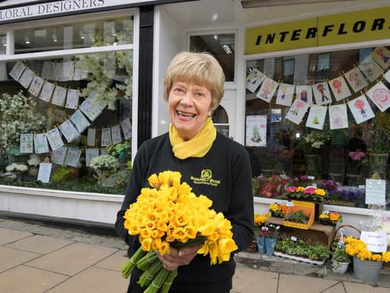 Margaret Mason outside her florists