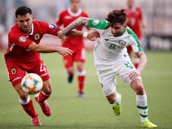 Sean Maguire battles for possession against Gibraltar's Jack Sergeant.  Photo: Getty Images