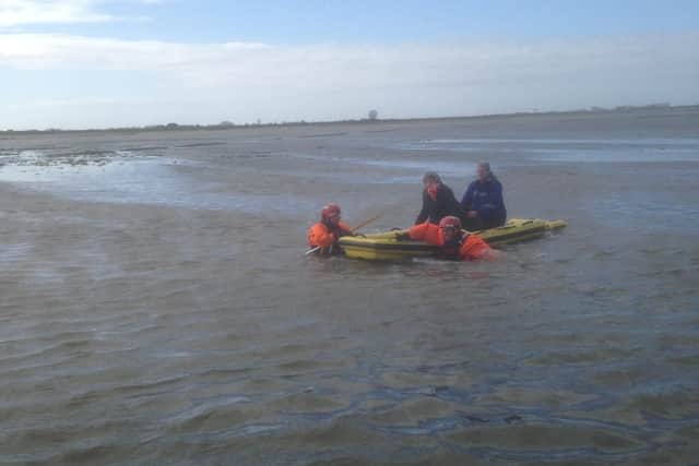 Two women, aged in their 40s, had ventured into the marshes with their dogs but had to be rescuedafter becomingtrapped by the incoming tide. Pic - Chris Kelly and Peter Kenworthy.