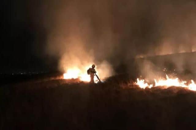 Firefighters battled to contain a moorland blaze at Winter Hill on Saturday,March 23. Pic - Shaun Walton.