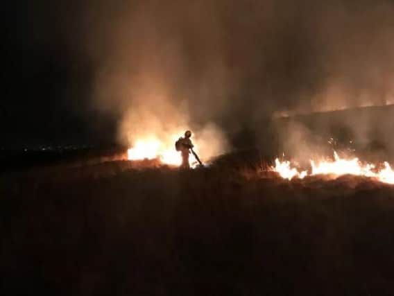 Firefighters battled to contain a moorland blaze at Winter Hill on Saturday,March 23. Pic - Shaun Walton.