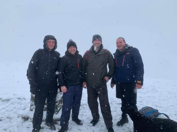 Sam Nicholls, Tom Smith, Michael Griffiths, Adam Holt and Bentley at Pen-y-ghent on their Yorkshire Three Peaks Challenge for Rosemere Cancer Foundation