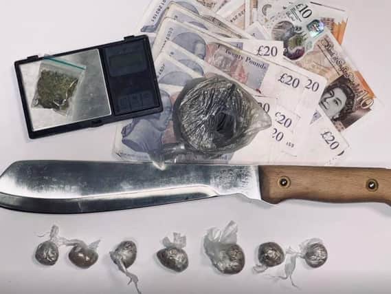 The seized stash and a weapon