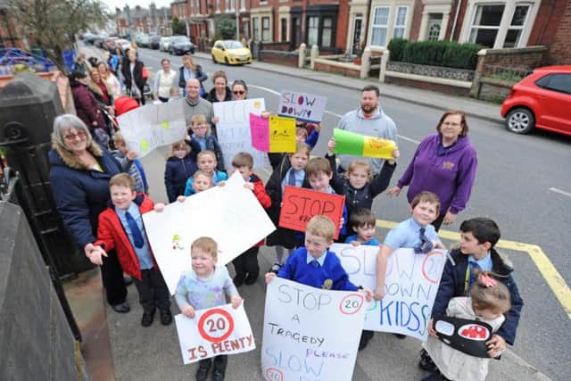 The protest outside Medlar with Wesham Church of England Primary School with the help of parents to urge motorists to slow down.
