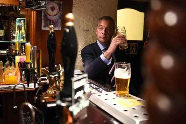 Nigel Farrage, in a pub