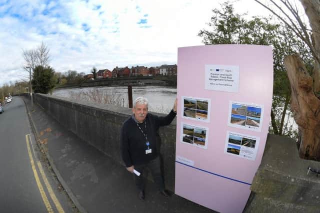 David Blake of Environment Agency with the mock up of the proposed wall at the River Ribble flood defence meeting in Penwortham
