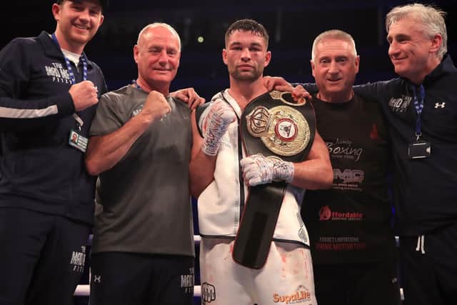 Scott Fitzgerald celebrates his win over Anthony Fowler with his team