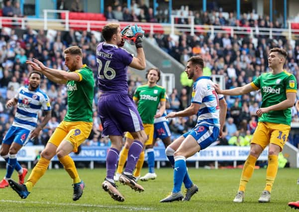 Louis Moult and Jordan Storey in the thick of the action as Reading keeper Emi Martinez gathers the ball