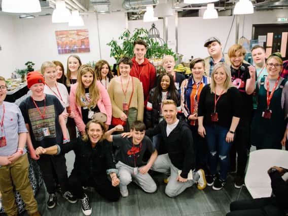 Take That meet with young cancer patients including Preston teenager Jack Singleton, 15, (back centre in red hoody) at the Teenage Cancer Trust concert at the Royal Albert Hall in London