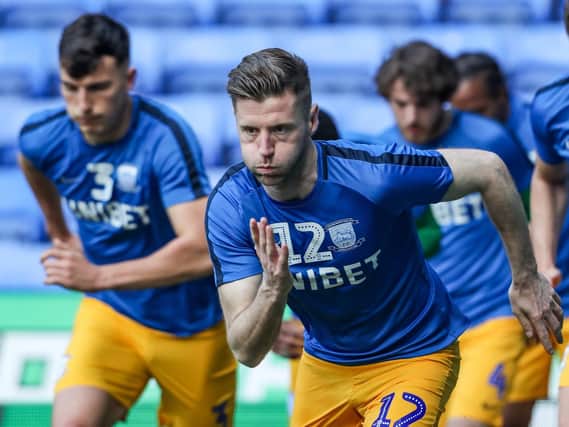 Paul Gallagher leads Preston's warm-up at Reading