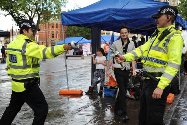 2018: Preston held its annual LGBT Pride Festival on the Flag Market. Special Constables Paul Taylor (left) and Conor Miller get some fencing tuition from Say Two Productions