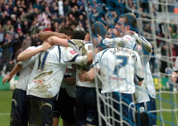 Two-goal Neil Mellor is congratulated by his team-mates during the 3-1 win over Sheffield United at Deepdale