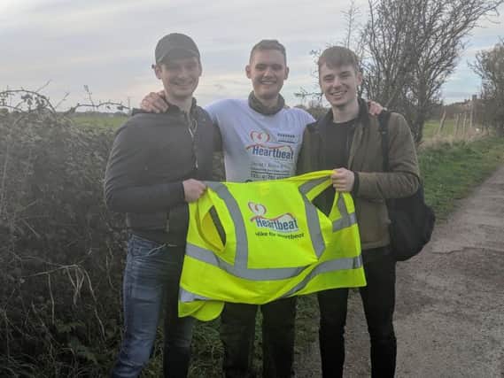 Sam Parr, of Chorley, (middle) who completed a 24-hour walk for Heartbeat
He is pictured with cousins Callum and Finn Allison