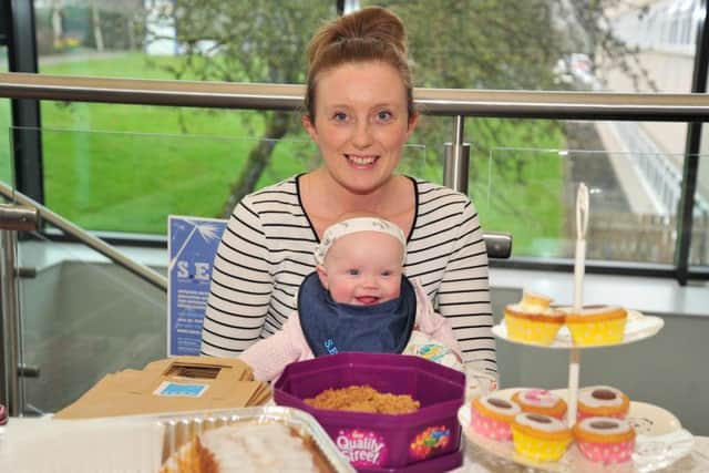 Vicki Farrington and Sophia-Rose, 6 months, on the cake stall at the Seed awareness event