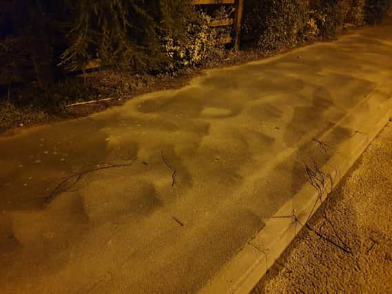 Dust gathered on the pavement opposite the new Morris Homes development in Penwortham - outside existing properties