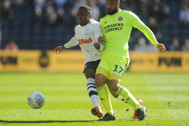 Darnell Fisher competes with David McGoldrick
