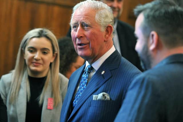 Prince Charles meets people from a variety of groups at The Old Courts, Wigan last week.
