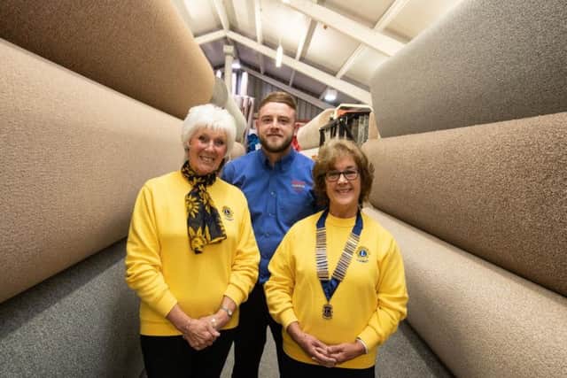Scott Astley, assistant manager at United Carpets, with Velma Boulter  and President of Chorley Lions Barbara Morgan
Pictures by Paul Currie