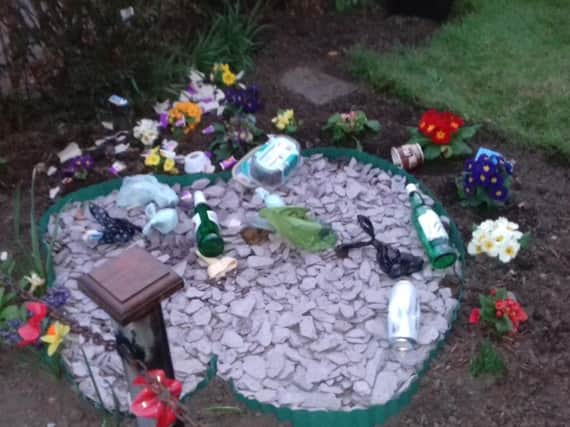 The vandalised memorial garden at St Ambrose Church