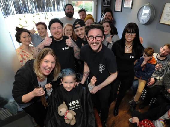 Dexter Ormerod with the staff at 468 Barbers in Lostock Hall