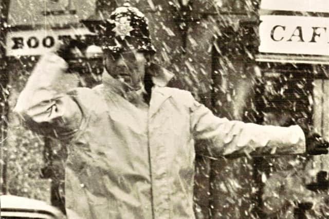 PC George Bell, of Preston Borough Police, in the police box in Church Streeet during a snowstorm in the 1960s