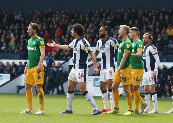 Preston and West Bromwich players line up at a free-kick