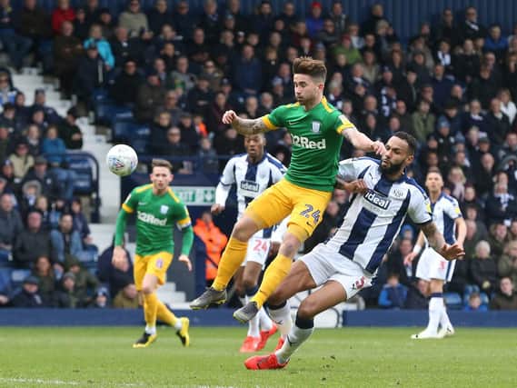 Sean Maguire in the thick of the action for Preston against West Bromwich