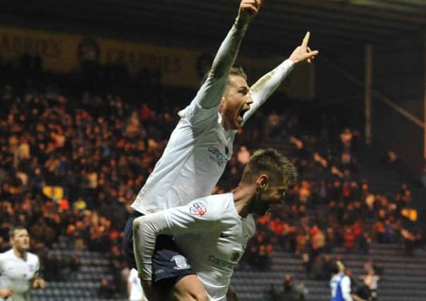 Joe Garner is given a piggy-back by Paul Gallagher after completing his hat-trick in Preston's 3-2 FA Cup replay win over Ipswich in January 2014