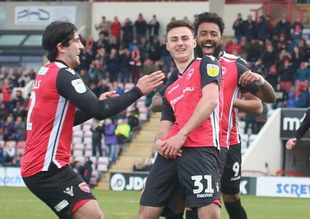 Aaron Collins celebrates putting Morecambe in front against Grimsby Town last weekend