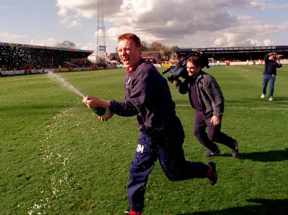 Preston manager David Moyes celebrates his side's Second Division title-win at Cambridge in April 2000