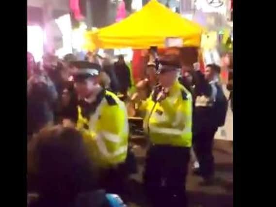 Police dancing at the demonstration (Pic via @WildlifeCafe on Twitter)