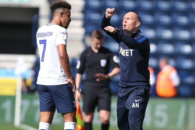 Callum Robinson takes instructions from PNE manager Alex Neil in the 4-0 win against Ipswich