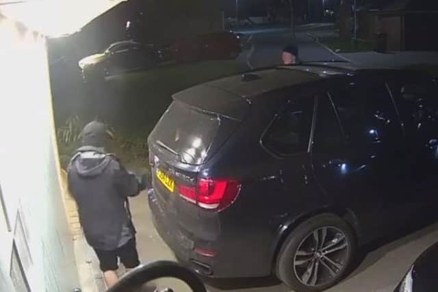 Men target a car on a resident's drive in Whittle-le-Woods