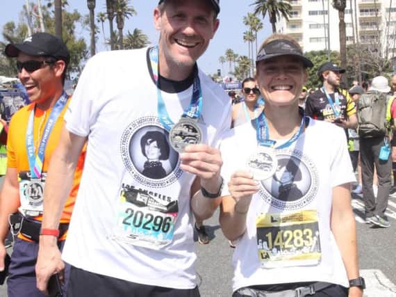 Brother and sister James and Lucy Ralph at the finish line of the Los Angeles marathon.