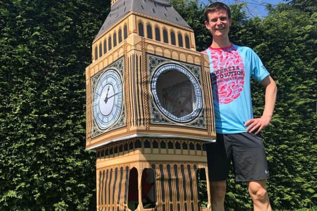 Lukas Bates, with his Elizabeth Tower costume, who will attempt to break a world record running in the costume at the 2019 Virgin Money London Marathon on Sunday.