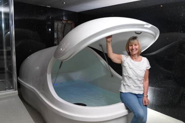 Tina Burrows with one of the floatation pods