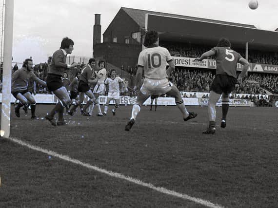 Preston's No.10 Mike Elwiss involved in a goalmouth scramble against Gillingham in April 1976