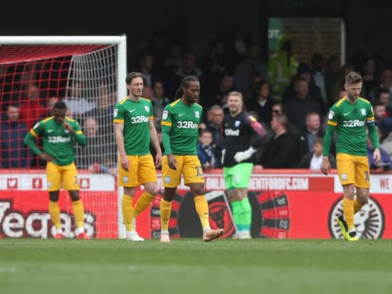 Preston North End players look dejected after conceding the first goal at Brentford