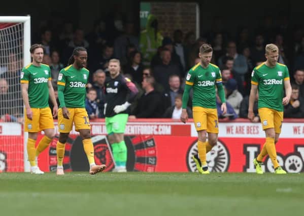 Preston players look dejected after falling behind at Brentford