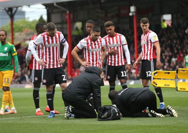 Concerns for Brentford's Julian Jeanvier who was stretchered offPhotographer