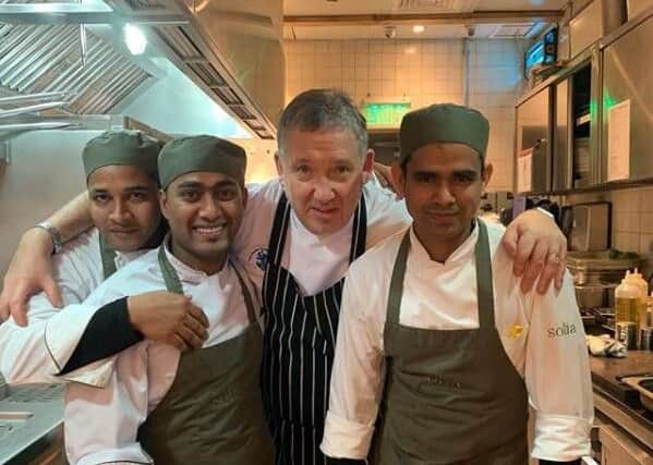 John Benson-Smith with his team in the kitchen