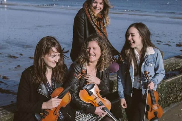 The three fiddle players and pianist make up Fara