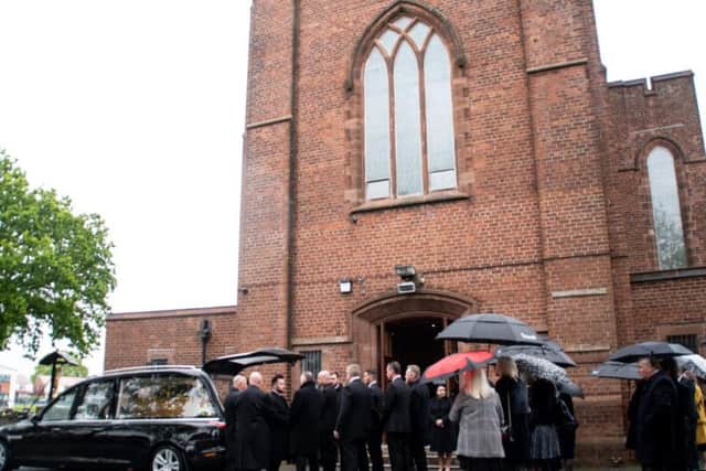 Hearse arrives at Our Lady & St Gerards RC Church in Lostock Hall for the funeral of Graham Walton