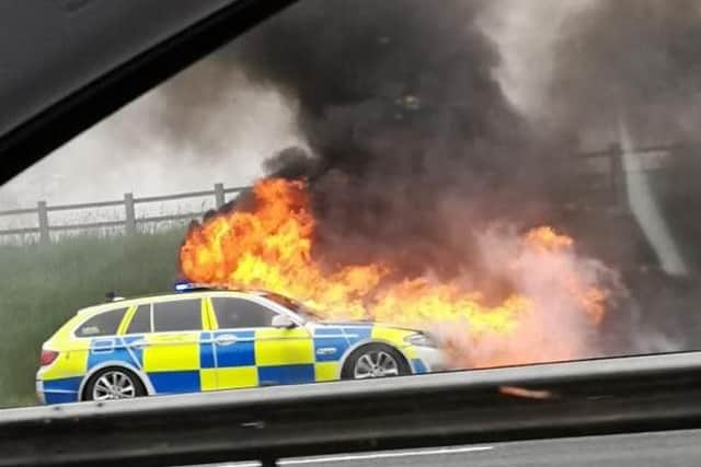 The police car is understood to have sustained a mechanical fault before it caught fire on the hard shoulder of the M6 near Preston on Wednesday (May 8). Credit - Sharron (@peapodlets)