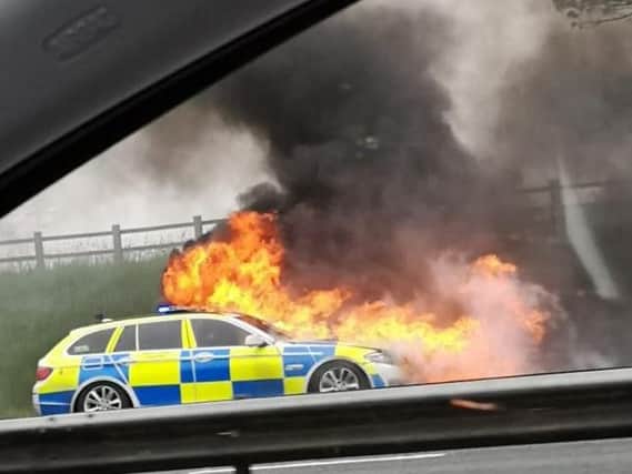 The police car is understood to have sustained a mechanical fault before it caught fire on the hard shoulder of the M6 near Preston on Wednesday (May 8). Credit - Sharron (@peapodlets)